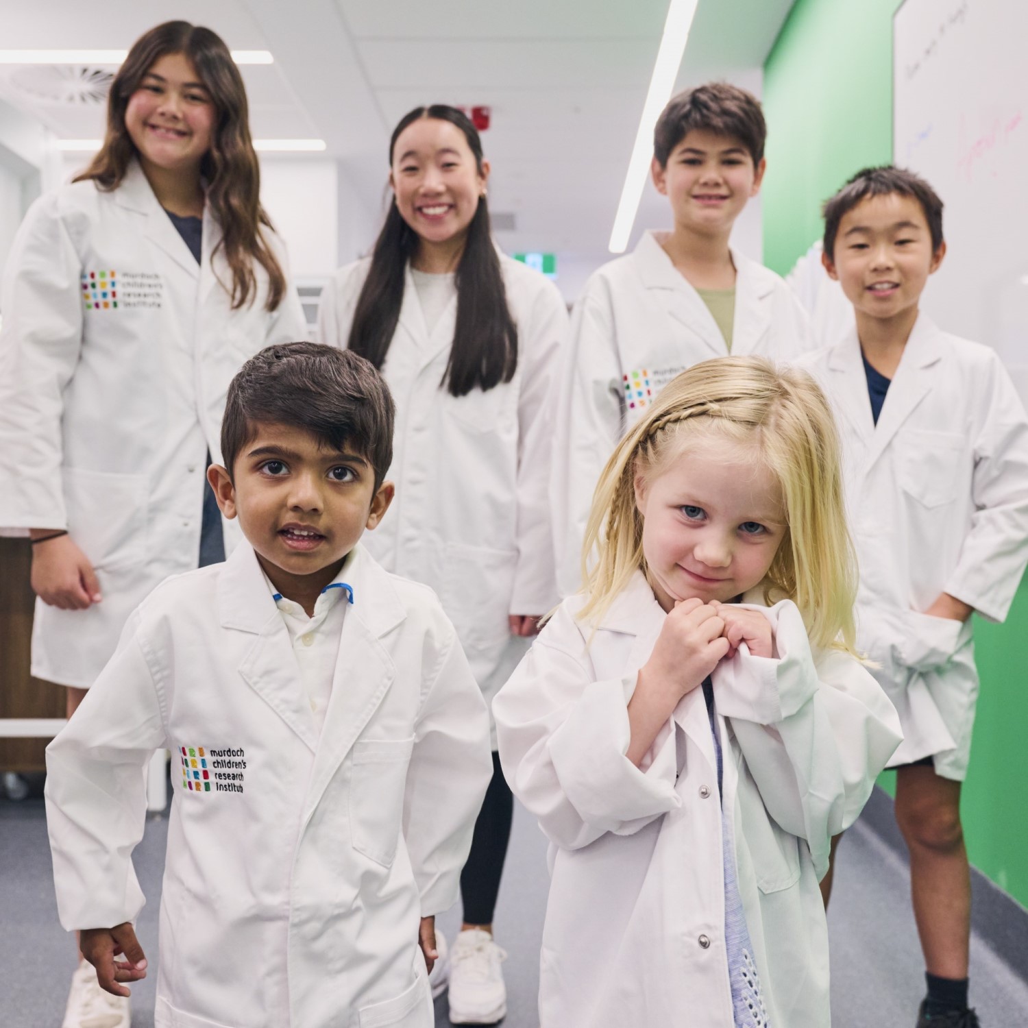 Children in MCRI lab coats